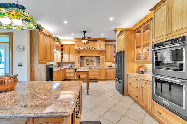 kitchen with freestanding refrigerator, open shelves, multiple ovens, ceiling fan, and light tile patterned flooring