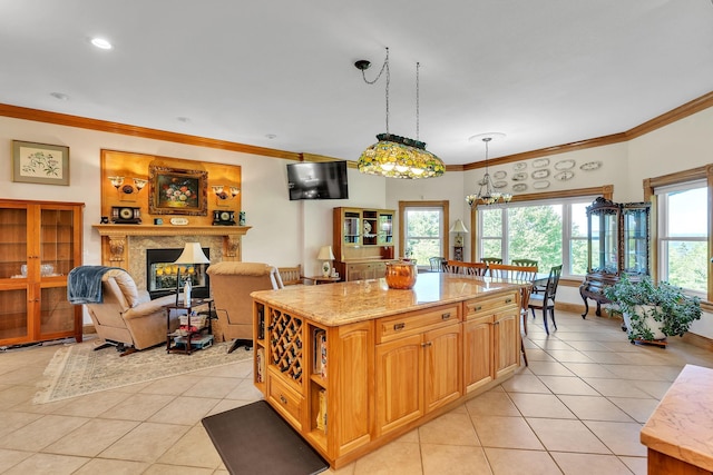 kitchen with light tile patterned floors and crown molding