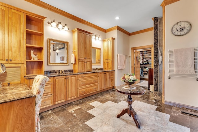 full bath featuring crown molding, double vanity, marble finish floor, and recessed lighting