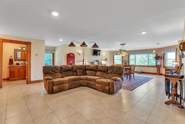 living area featuring light tile patterned flooring, a wealth of natural light, and recessed lighting