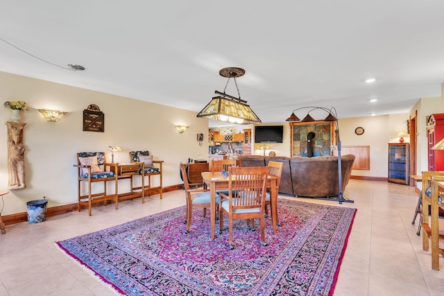 dining space with light tile patterned floors, baseboards, and recessed lighting