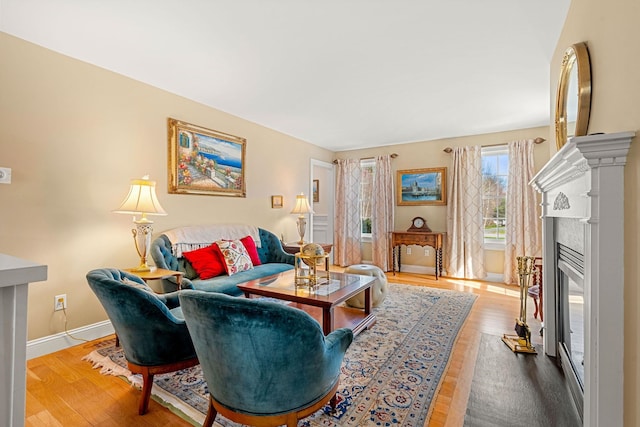 8 Palis Dr, Salisbury, MA 01952 - living area with a premium fireplace, baseboards, and wood finished floors