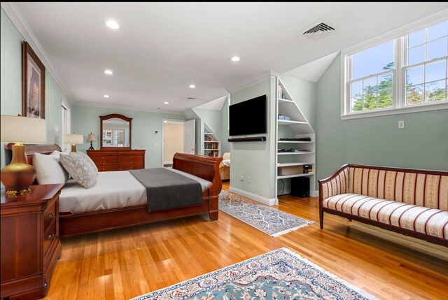8 Palis Dr, Salisbury, MA 01952 - bedroom featuring multiple windows, ornamental molding, visible vents, and light wood-type flooring
