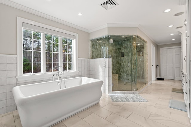 8 Palis Dr, Salisbury, MA 01952 - full bath with tile walls, visible vents, a shower stall, ornamental molding, and recessed lighting
