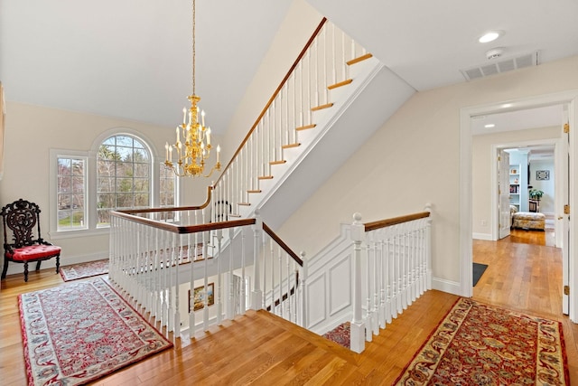 8 Palis Dr, Salisbury, MA 01952 - staircase with recessed lighting, baseboards, an inviting chandelier, visible vents, and wood finished floors