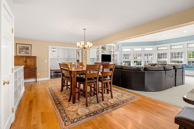 8 Palis Dr, Salisbury, MA 01952 - dining space with a chandelier, a wealth of natural light, and light wood-type flooring