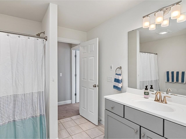 full bathroom featuring baseboards, tile patterned flooring, vanity, and a shower with shower curtain