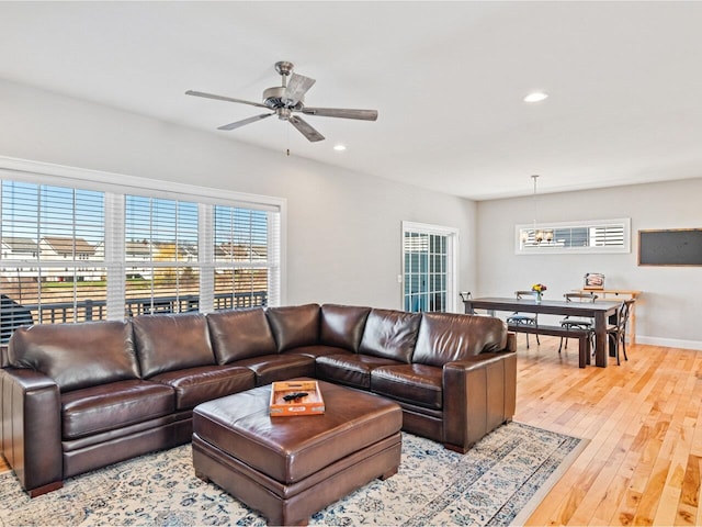 living area with recessed lighting, a ceiling fan, a healthy amount of sunlight, and hardwood / wood-style flooring