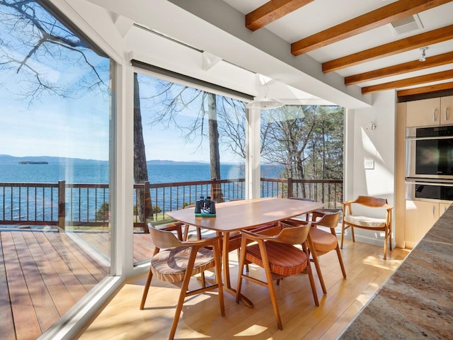 25 Oakledge Dr, Burlington, VT 05401 - sunroom featuring beam ceiling, a water view, and visible vents