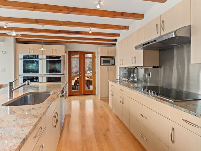 25 Oakledge Dr, Burlington, VT 05401 - kitchen with french doors, a sink, beam ceiling, stainless steel appliances, and under cabinet range hood