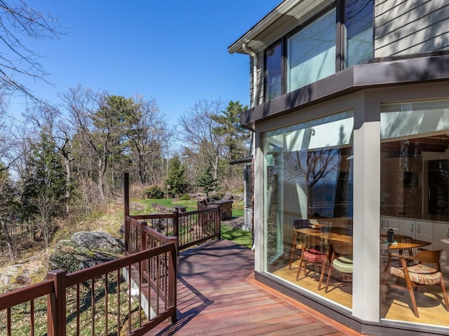 25 Oakledge Dr, Burlington, VT 05401 - wooden terrace featuring a sunroom and outdoor dining space