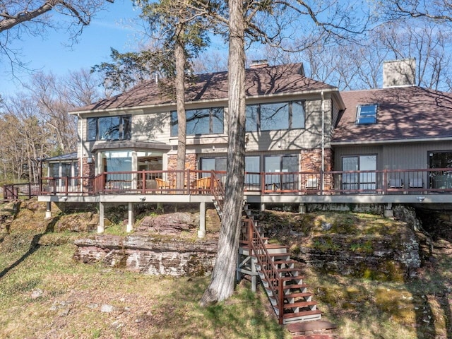25 Oakledge Dr, Burlington, VT 05401 - back of house with a chimney, stairway, and a wooden deck