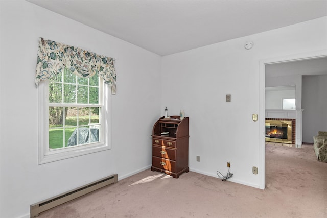 carpeted empty room with baseboards, a baseboard radiator, and a brick fireplace