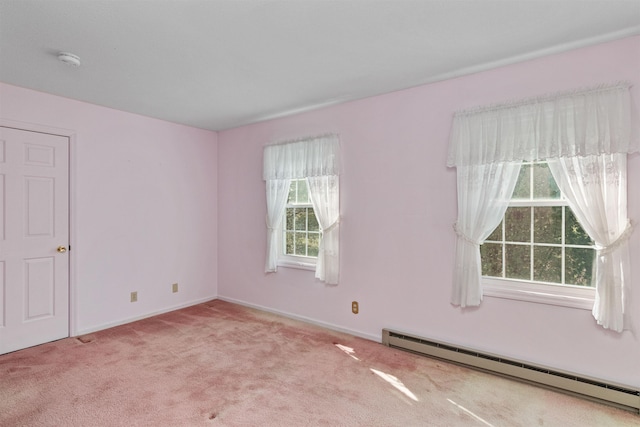 carpeted empty room with baseboards and a baseboard radiator