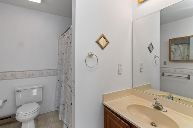 full bathroom with vanity, toilet, and a baseboard heating unit