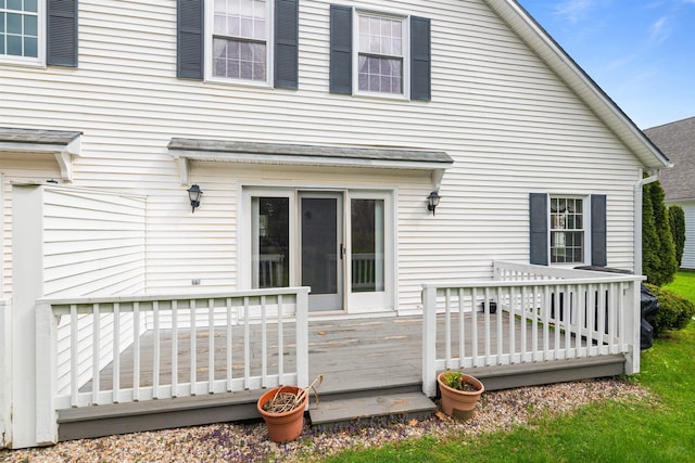 rear view of property featuring a deck