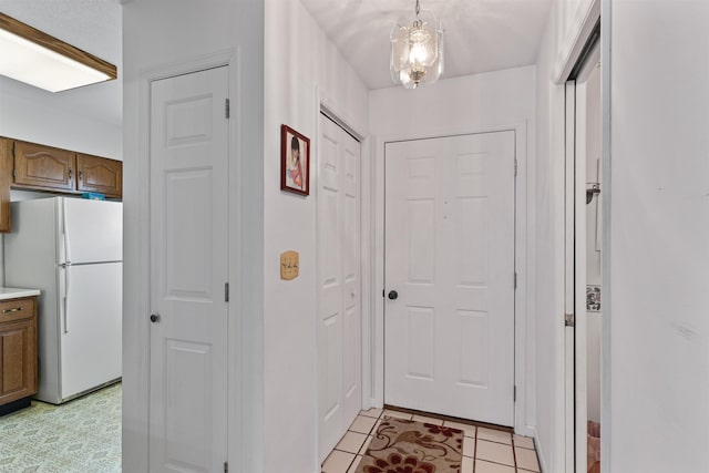 entryway featuring light tile patterned floors