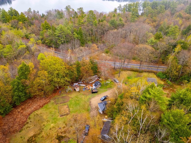 birds eye view of property with a wooded view