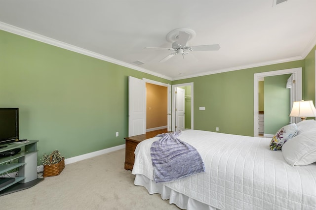 carpeted bedroom with crown molding, visible vents, baseboards, and a ceiling fan