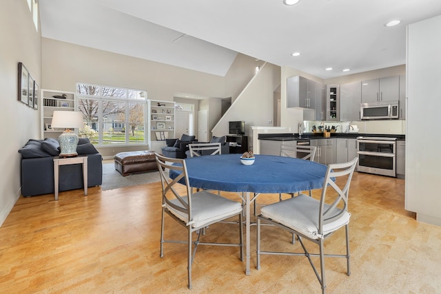 dining area with baseboards and recessed lighting