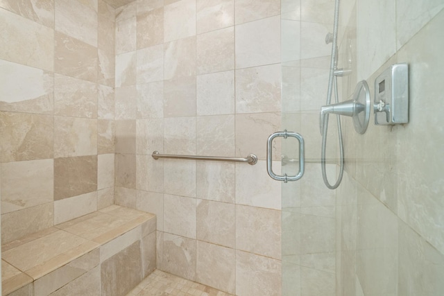 full bath with a shower stall
