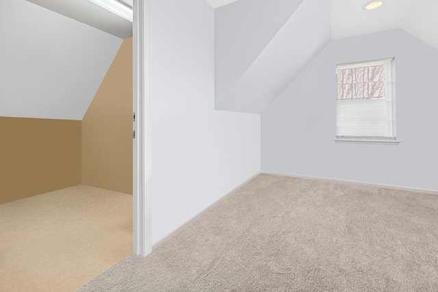 bonus room with baseboards, carpet flooring, and vaulted ceiling