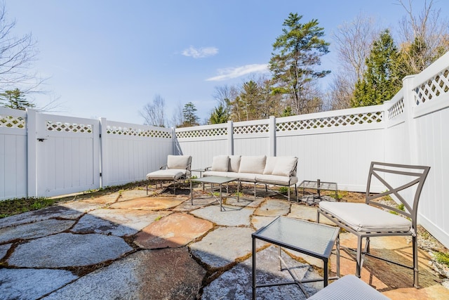 view of patio / terrace featuring outdoor lounge area and a fenced backyard