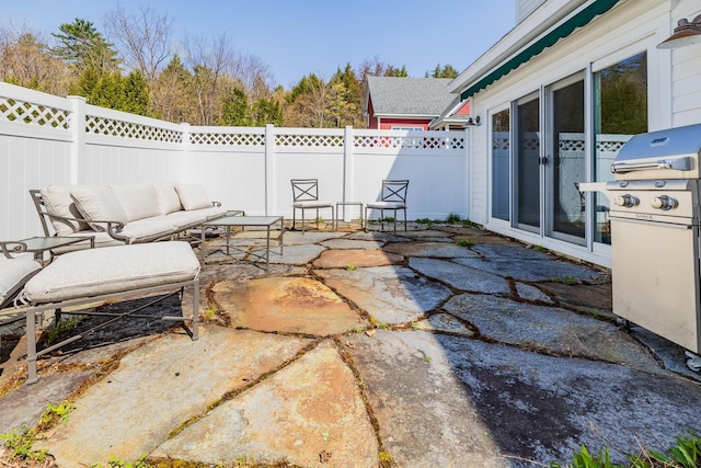 view of patio with a fenced backyard, grilling area, and an outdoor hangout area