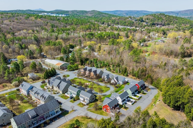 bird's eye view featuring a residential view, a mountain view, and a view of trees
