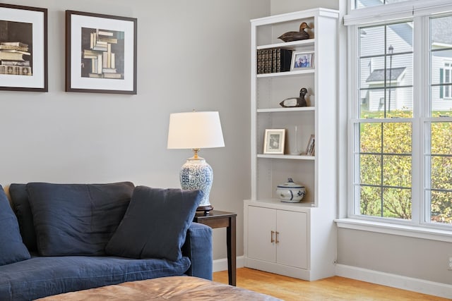 interior space with light wood finished floors and baseboards