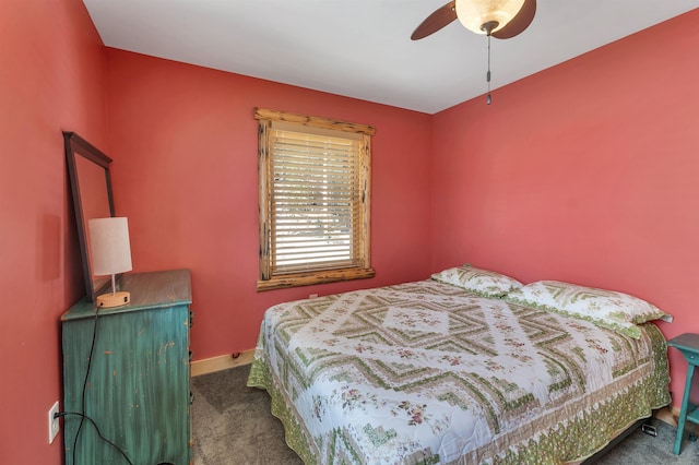 carpeted bedroom with ceiling fan and baseboards