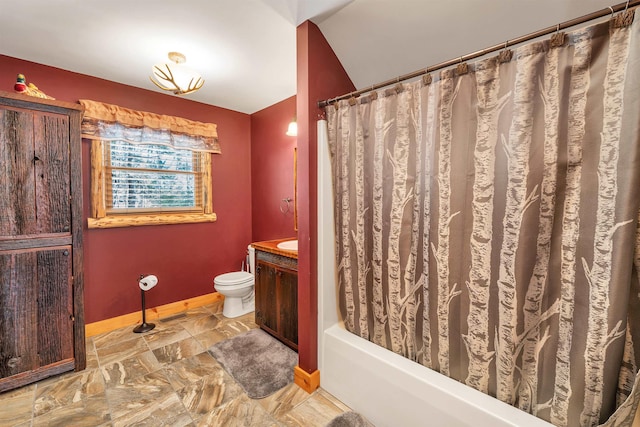 bathroom with vanity, toilet, baseboards, and visible vents