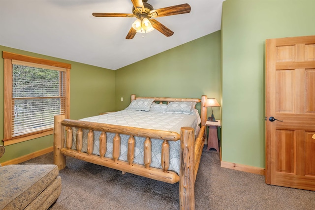carpeted bedroom with baseboards, lofted ceiling, and ceiling fan