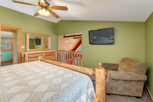 bedroom featuring baseboards, ceiling fan, and vaulted ceiling