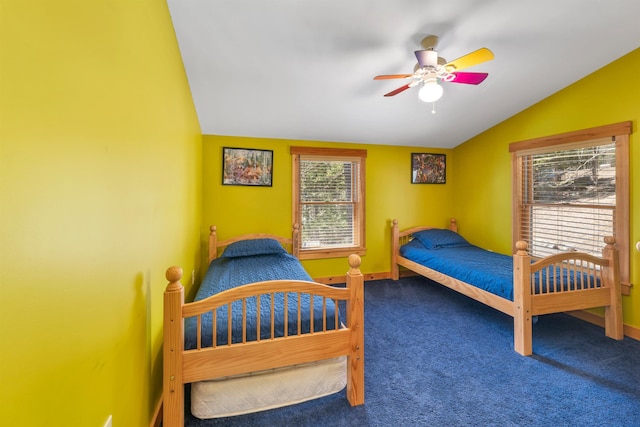 bedroom featuring carpet flooring, baseboards, lofted ceiling, and ceiling fan