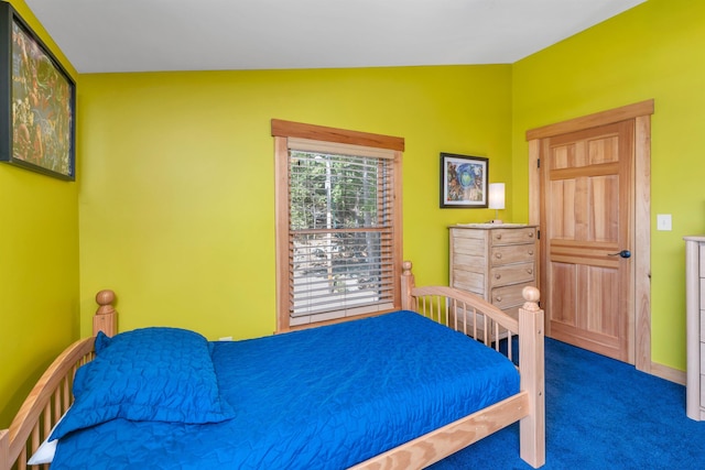 bedroom featuring carpet flooring and baseboards