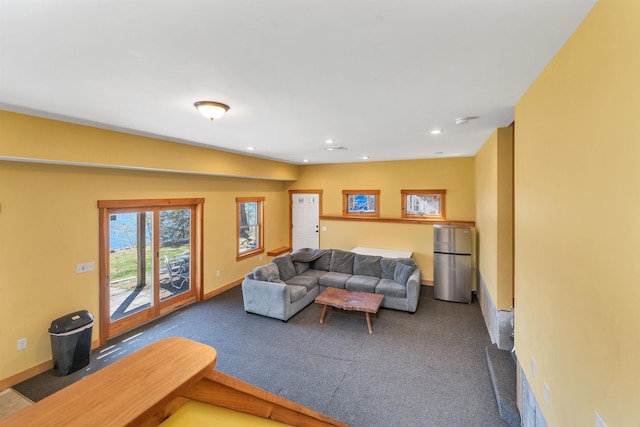 carpeted living room with baseboards and recessed lighting