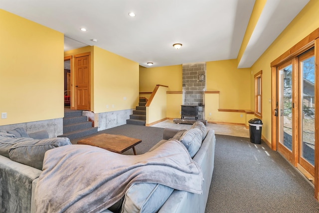 carpeted living area featuring stairway and recessed lighting