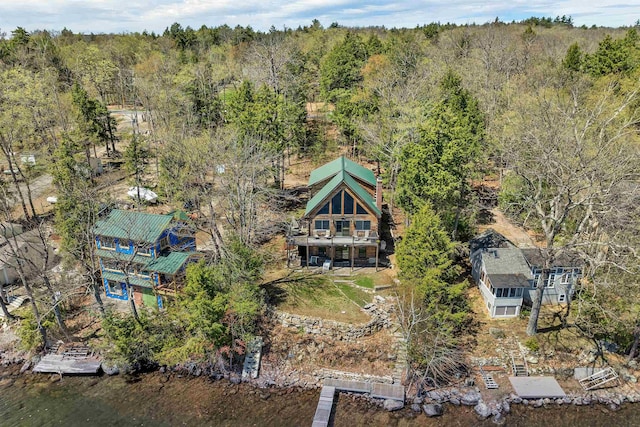 bird's eye view featuring a wooded view