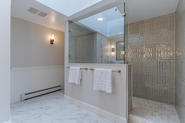 full bathroom with walk in shower, a wainscoted wall, marble finish floor, visible vents, and baseboard heating