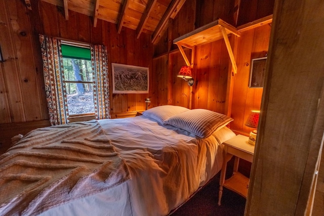 bedroom featuring wooden walls, wood ceiling, and lofted ceiling with beams