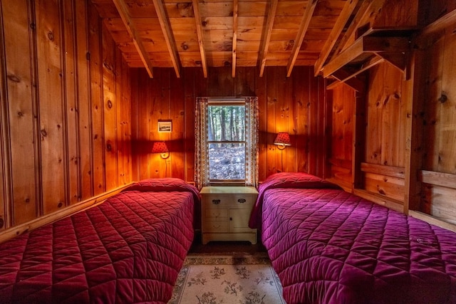 bedroom with wood walls, wood ceiling, and beamed ceiling