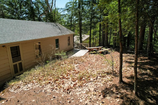 view of yard featuring a wooden deck