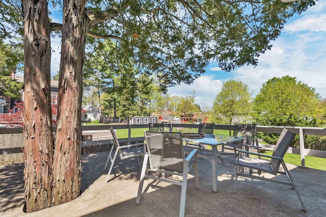 view of patio featuring outdoor dining area