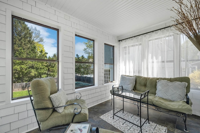 sunroom featuring stone finish floor