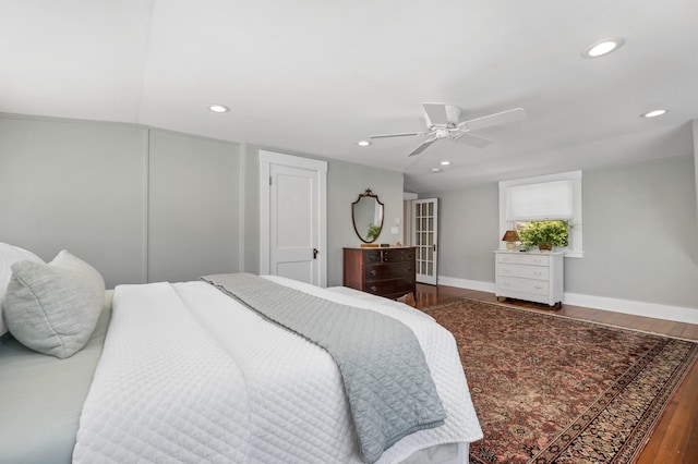 bedroom featuring wood finished floors, baseboards, ceiling fan, and recessed lighting