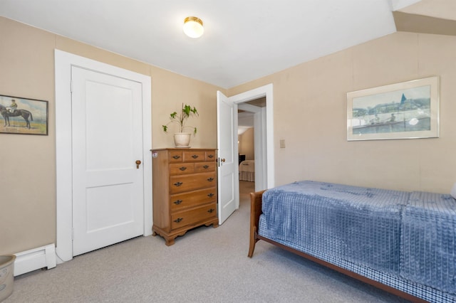 carpeted bedroom featuring a baseboard radiator