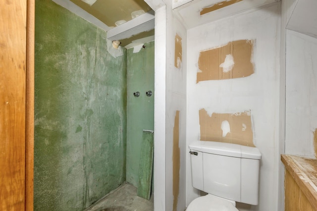 bathroom featuring toilet and a shower