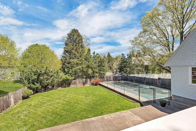 view of yard with a fenced in pool and a fenced backyard