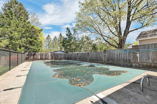 view of pool with fence